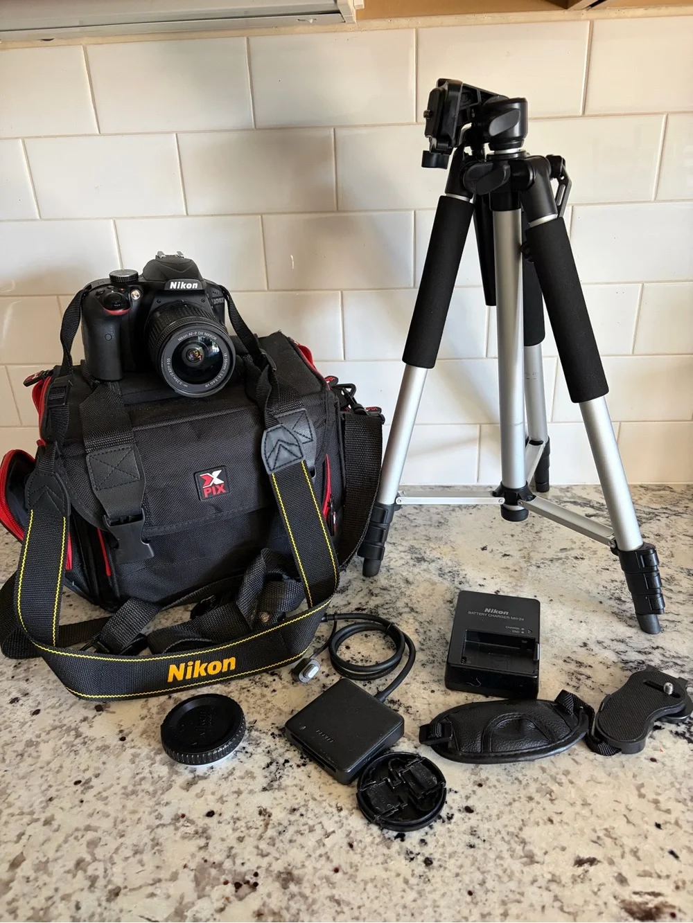 Nikon Black DSLR with AF-P DX NIKKOR Lens and Yellow-Accented Strap